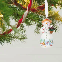 Hallmark Snowtop Lodge Terran S. Gardner Porcelain Ornament 9 Hallmark Snowtop Lodge Terran S. Gardner Porcelain Ornament -Hallmark shop Snowman with Flower Pot Keepsake Ornament 2299QXR8119 02